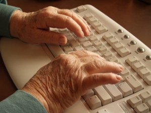 img-seniors-hands-typing-at-keyboard
